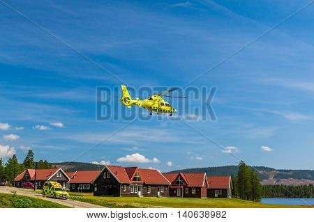 Klövsjö, Jämtland, Sweden - July 25, 2016: Ambulance vehicle and ambulance helicopter rescue.
Ambulance vehicle and helicopter after emergency rescue.