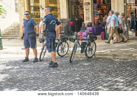 CORFU GREECE - June 11 2016. Police officers keeping a close and careful eye on people on the streets
