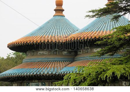 A Chinese designed roof on a gazebo in Tiantan park or temple of heaven scenic area in Beijing China.