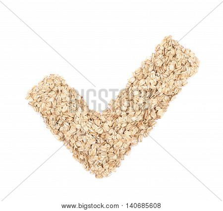 Yes tick shape made of oatmeal flakes isolated over the white background
