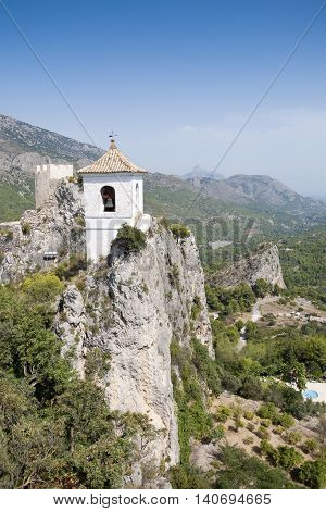 Belfry on the peak of the mountain. This tower belongs to Alcozaiba fortress built by muslims at XI century. Picture taken in El Castell de Guadalest Alicante Spain.