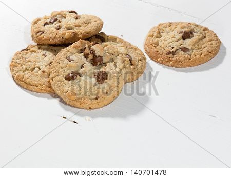 cookies with chocolate chunks on a white wooden table