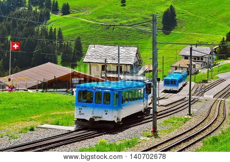 Rigi mountain Switzerland - June 10 2010: Blue Passenger trains arrives to the Rigi Staffel station.