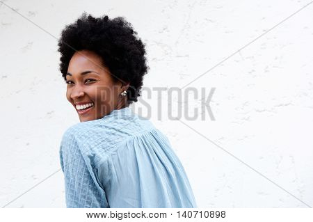 Smiling Young African Lady Looking Back