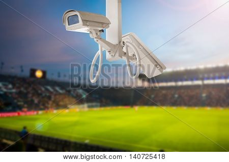 CCTV camera stadium football on twilight background.