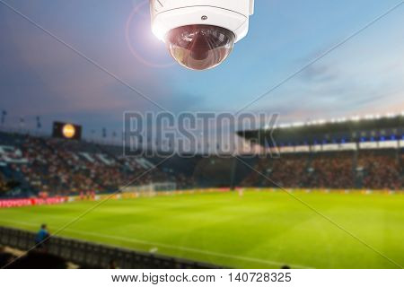 CCTV camera stadium football twilight on background.