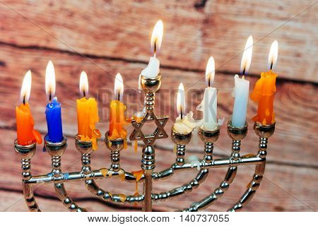 Image of jewish holiday Hanukkah background with menorah traditional candelabra Burning candles menorah, hanuka