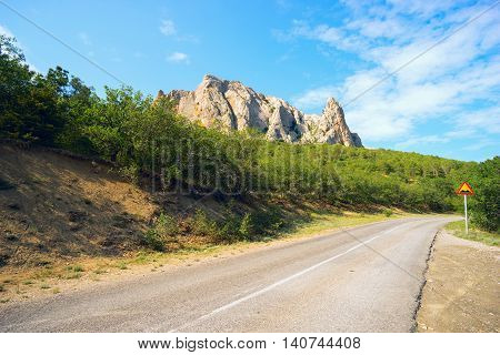 Road in the mountains of the Crimea on a Sunny summer day.