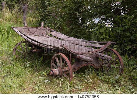 Old wooden wagon to transport people with horses