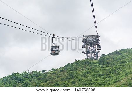 HONG KONG - MAY 26: The Ngong Ping 360 cable cars carry tourists to Ngong Ping village in the cloudy day on May 26 2016 in Hong Kong.