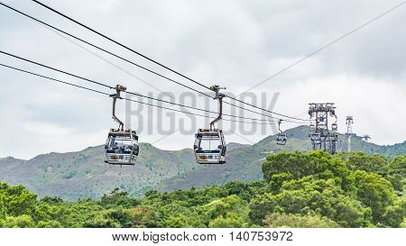 HONG KONG - MAY 26: The Ngong Ping 360 cable cars carry tourists to Ngong Ping village in the cloudy day on May 26 2016 in Hong Kong.