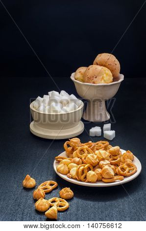 Cookies sugar ceramic tableware against a dark background