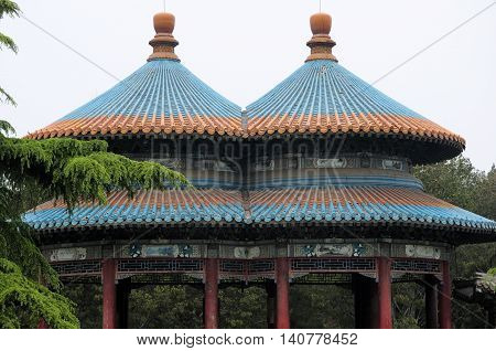 A Chinese designed roof on a gazebo in Tiantan park or temple of heaven scenic area in Beijing China.