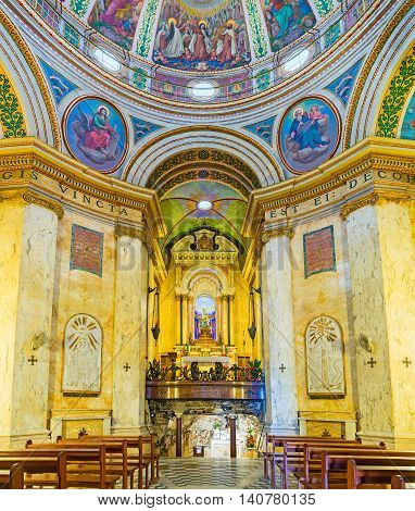 HAIFA ISRAEL - FEBRUARY 20 2016: The prayer hall of Stella Maris Monastery located on the Carmel Mount with the cave at the altar on February 20 in Haifa.