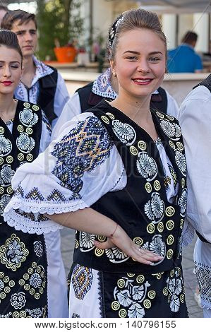 ROMANIA TIMISOARA - JULY 7 2016: Young Romanian dancers in traditional costume present at the international folk festival "International Festival of hearts" organized by the City Hall Timisoara.