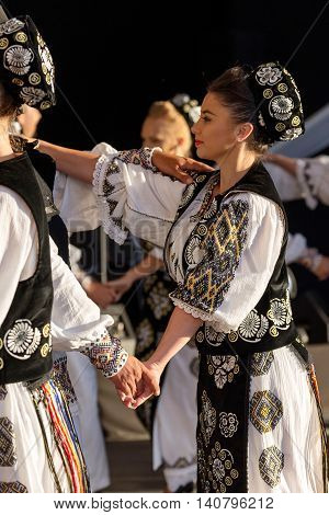 ROMANIA TIMISOARA - JULY 7 2016: Romanian dancers in traditional costume present at the international folk festival "International Festival of hearts" organized by the City Hall Timisoara.