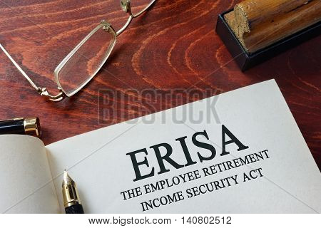 Page with ERISA The Employee Retirement Income Security Act of 1974  on a table.