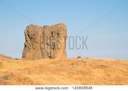 Large rock on the seashore during the day