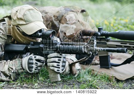 Sniper and spotter of Green Berets US Army Special Forces Group in action