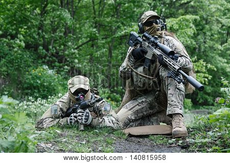 Sniper and spotter of Green Berets US Army Special Forces Group in action