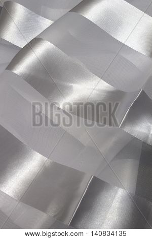 This is a photograph of striped White Polyester fabric scarf with sheer insert