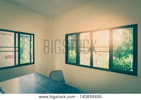 Home office interior background in morning time. Working at home concept with vintage fiter effect