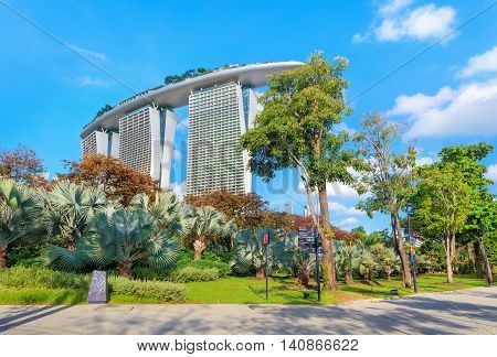 Singapore, Republic of Singapore - May 4, 2016: Gardens by the Bay with Marina Bay Sands hotel on background