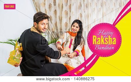 season's greeting card showing Indian young male and his sister celebrating Rakhi festival or raksha bandhanor Rakshabandhan  in traditional attire