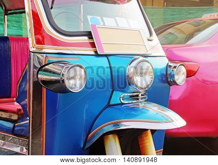 Traditional Asian taxi - blue Tuk-Tuk urban vehicle