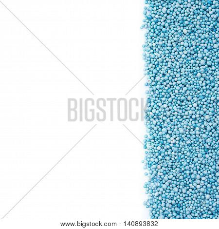 Top View Of Pattern Blue Urea Fertilizer Isolated On White