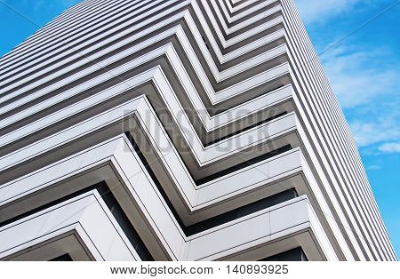 Modern building skyscraper on blue background sky.
