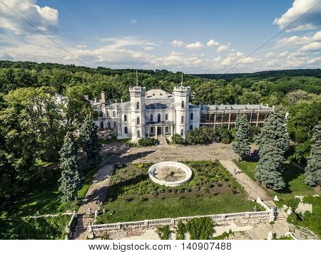 beautiful aerial view on White Swan palace and yard in Sharivka park, Kharkiv region, Ukraine