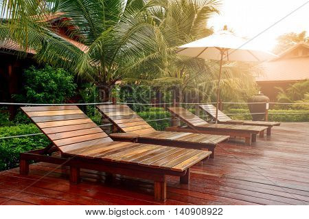 Relax time outdoor with wooden bed in summer sunlght.