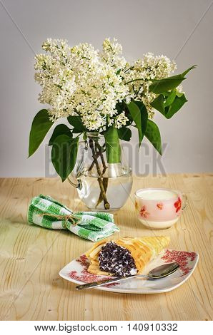 Breakfast with yogurt and Belgian waffles white lilacs