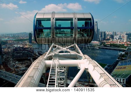 Singapore - December 18 2007: A passenger capsule at the top of the 541 foot high Singapore Flyer offers a birdseye view of the city and neighbouring Indonesia and Malaysia