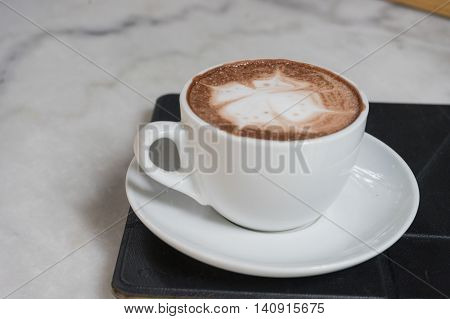 hot fresh coffee in white cup on marble table on tablet and white saucer cappuccino coffee mocha coffee espresso coffee latte coffee