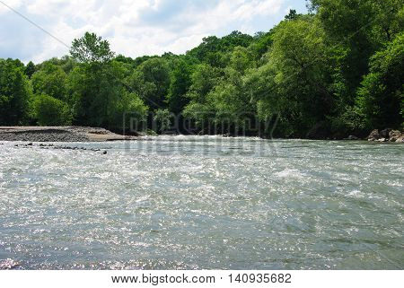 Waves on a mountain river in summer. Caucasus
