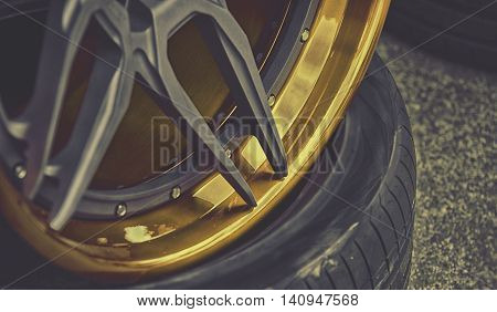 Closeup Detail Of Gold Aluminum Car Wheel