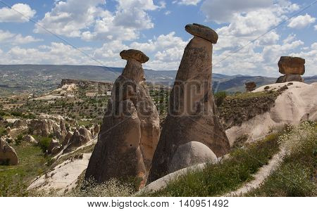 Cappadocia stone freaky pillars on valley background