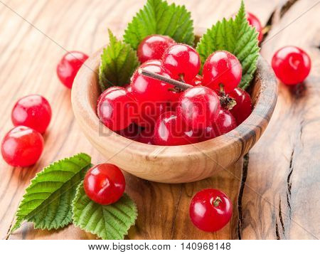 Nanking or felted cherry ftuits with leaves on the wooden table.