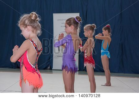 Warsaw Poland - June 25 2016:  A group of girls begin their art gymnastics performance