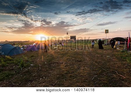 KRAKOW POLAND - JUL 31 2016 World Youth Day and the Catholic youth International Convention July 25-31. Adoration of the Eucharistic Jesus in the rear sectors of the youth on standby at sunrise.