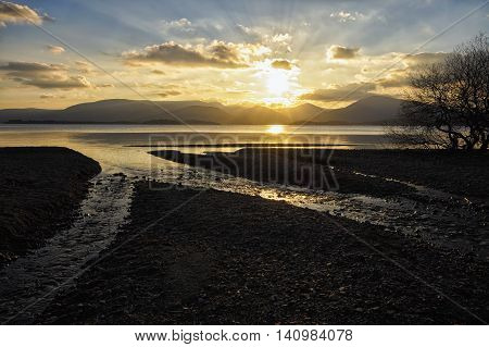 A shore line steam flowing to Loch lomond