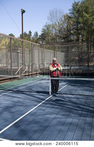 Happy Senior Athlete On Platform Tennis Paddle Court