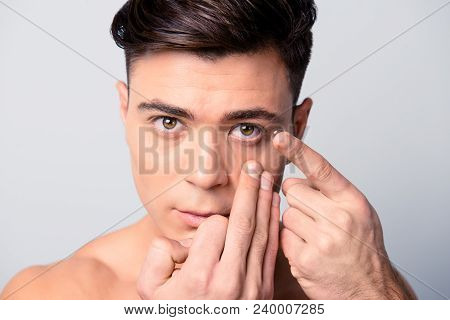 Concept Of Clear Vision Correction With Contact Lenses. Close Up Portrait Of Handsome Young Man Hold