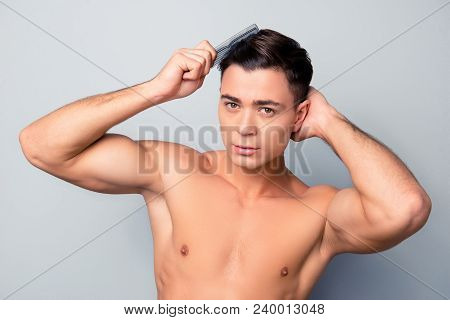 Portrait Of Sexy Handsome Confident Young Man With Naked Torso Combing His Hairdress And Furfur At T