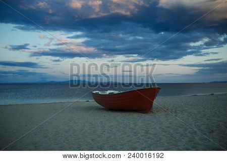 Fishermens Boat At Seacoast, On Sand At Sunset With Horisont Sea On Background. Travel And Rest Conc