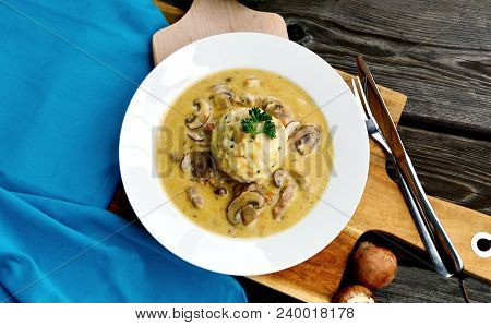 Sour Mushroom Sauce With Bread Dumpling (german Name Is Saure Schwammerlso