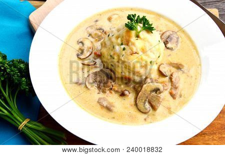 Sour Mushroom Sauce With Bread Dumpling (german Name Is Saure Schwammerlso
