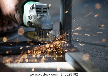 The Worker Is Welding Metal Part Of Table Steel In Factory.